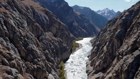 river flowing through a rocky canyon in the mountains