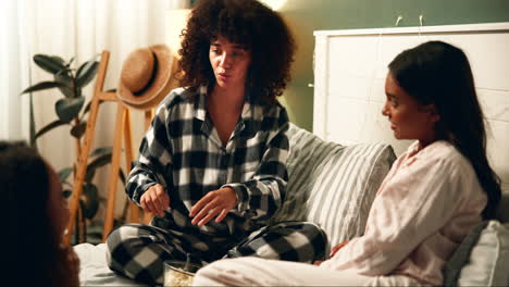 a group of young women having a pajama party in a bedroom