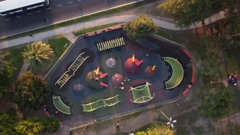 bird's eye view of children playing games in the park playground at sunset in buenos aires argentina