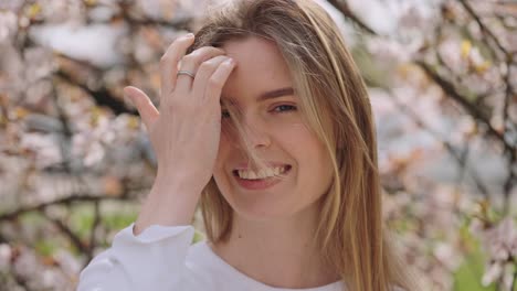smiling woman in spring flowers