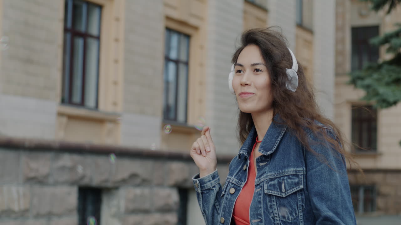 Woman Dancing to Music Outdoors