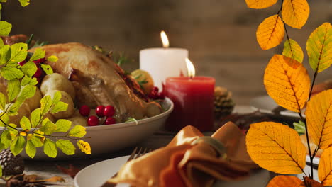 animation of autumn leaves falling over thanksgiving dinner background