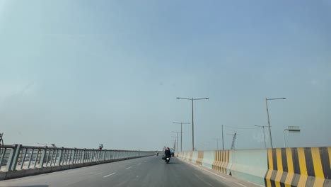 highway in bangladesh with road signs and traffic