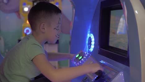 a boy in a moving game machine cabin