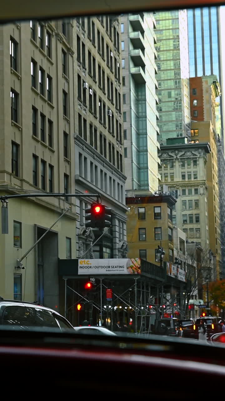 New York, USA, 8 October 2025: Midtown street with tall buildings. Tall Midtown towers rise above a calm street lined with older buildings