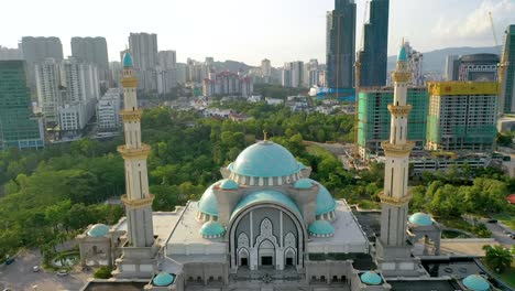 federal territory mosque, also known as masjid wilayah persekutuan on sunset in kuala lumpur - malaysia