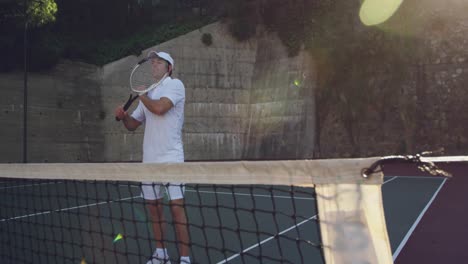 Man-playing-tennis-on-a-sunny-day