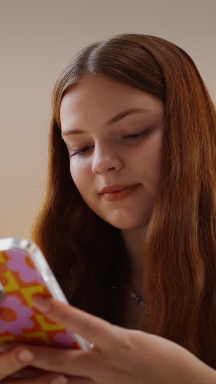 Teenage girl looking at her phone