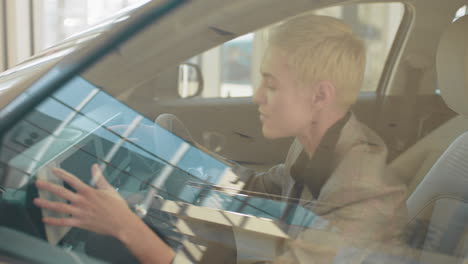 woman inspecting a new car interior