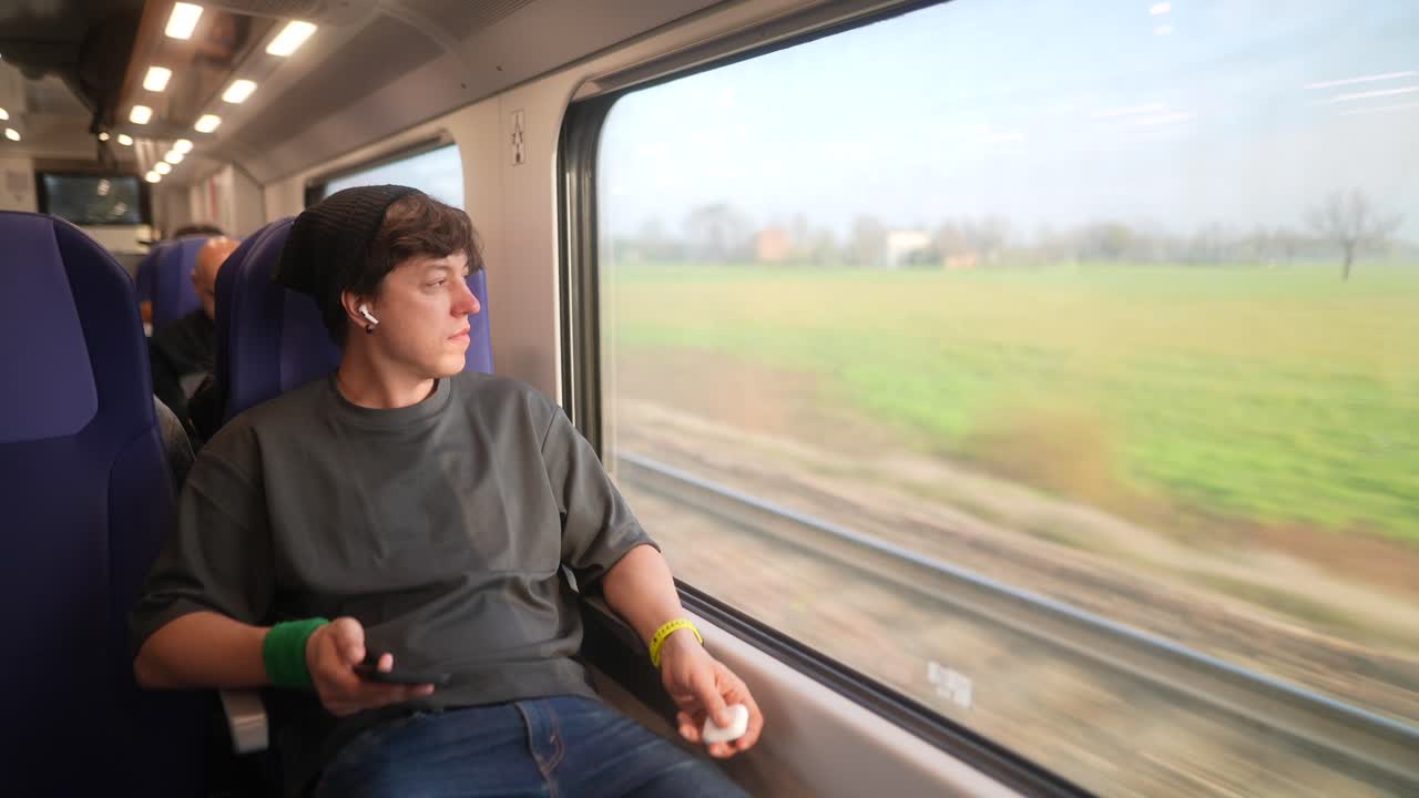 Young Man Traveling by Train
