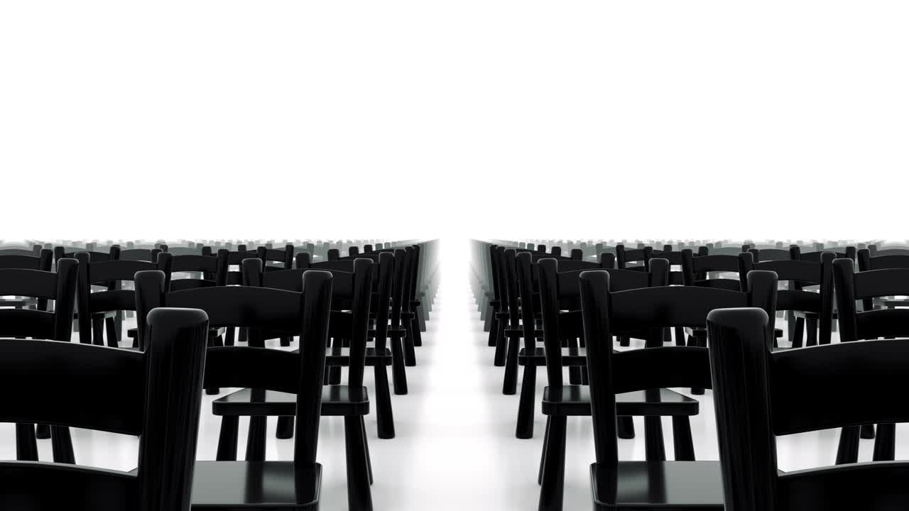 Moving away from the rows of chairs.