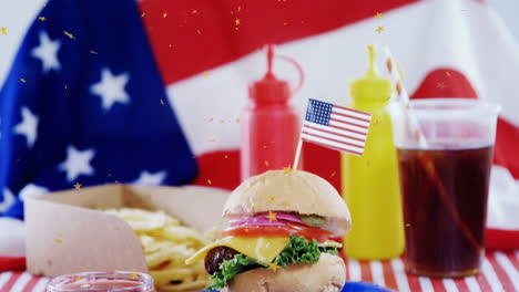 animation of dust floating over burger and drinks over flag of usa