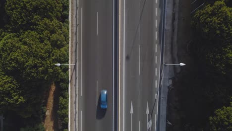 Static-aerial-top-down-view-of-street-with-light-traffic