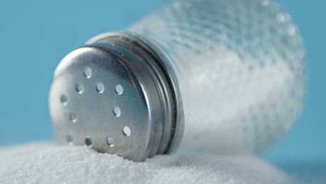 the glass jar with salt slowly rotates.