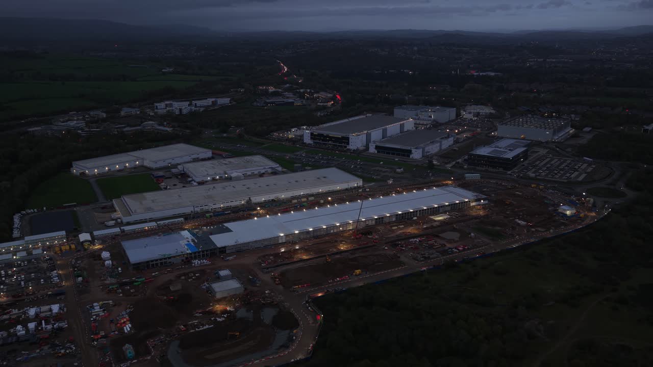 Aerial drone view of a huge commercial hyperscale data center campus near Cardiff, Wales, showing digital infrastructure, AI growth, construction, and large scale technology expansion