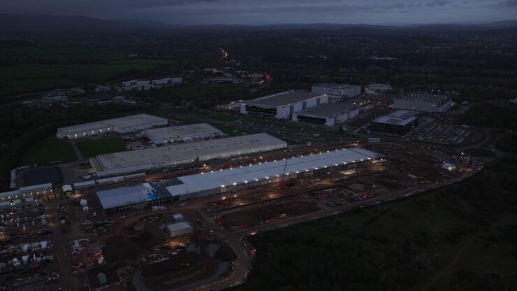 Aerial drone view of a huge commercial hyperscale data center campus near Cardiff, Wales, showing digital infrastructure, AI growth, construction, and large scale technology expansion