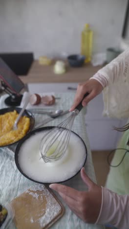 woman whipping eggs for dessert