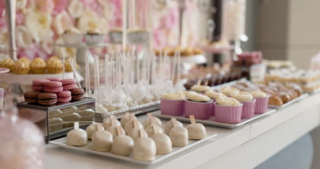 cute candy bar with various cakes and candies wedding candybar 4