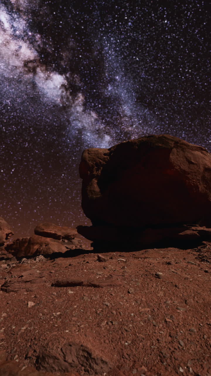 vía láctea sobre un paisaje desértico rojo