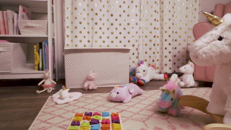 pan of little girl's room with stuffed animals and rocking unicorn in motion