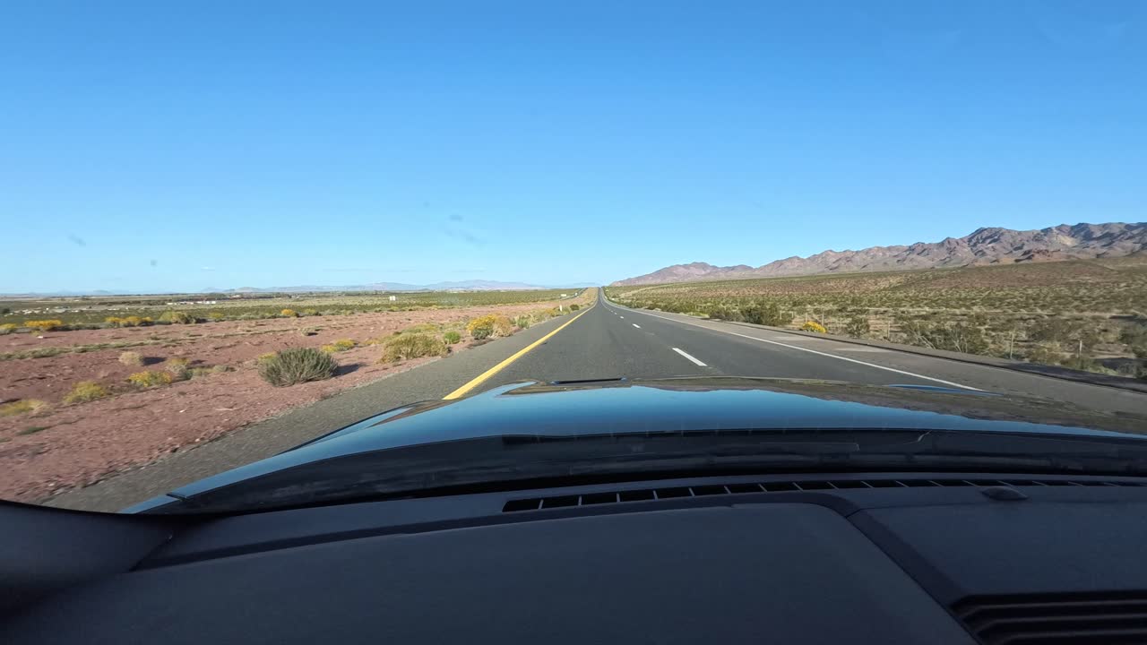 Driving the Interstate highway in California with mountains and beautiful blue skies