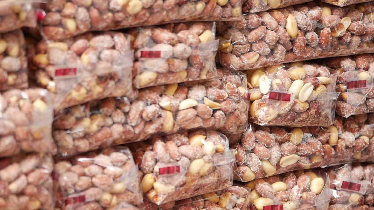 Stacked Bags of Salted Peanuts