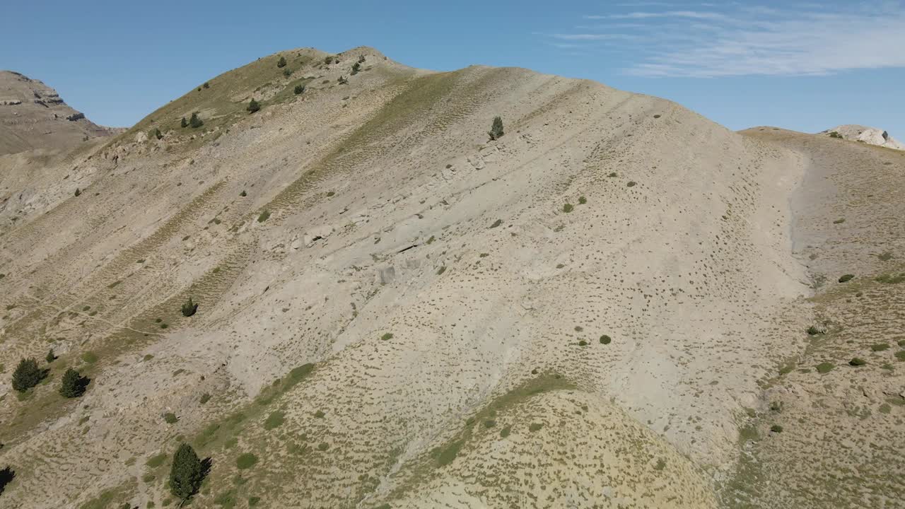 Aerial view of the top of the mountain range with some trees in La Cerdanya, Catalunya