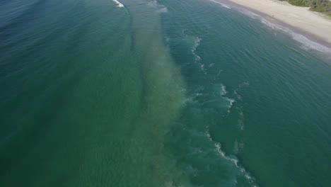 Sandy-Beach-And-Cityscape-In-Burleigh-Heads,-Gold-Coast,-Queensland,-Australia---drone-shot