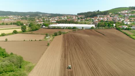 aerial view of rural field and tractor