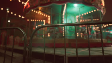 a blurred image of a lit up carousel at night