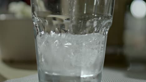 water in a glass with ice cubes in it