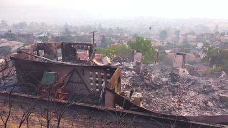 a burned home smolders on a hillside following the 2017 thomas fire in ventura county california