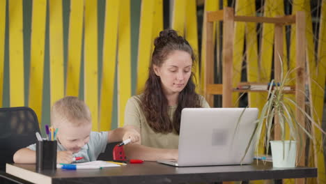 mother and son learning together at home