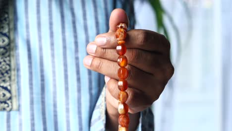 muslim man praying during ramadan, close up