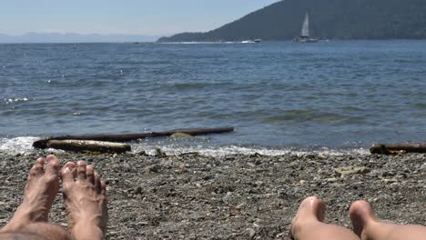 Feet-of-bathers-in-sand-on-beach