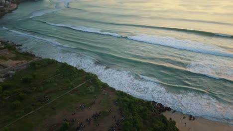 drone flight over the ocean, watching the sunset and coastline. dreamland beach, bali