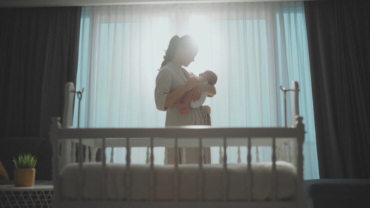 Mother and Newborn Baby by the Window