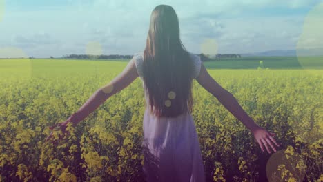 animation of light spots over caucasian woman walking on meadow