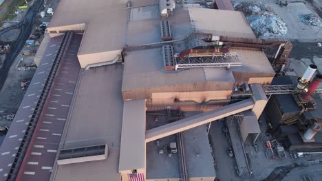 aerial view of industrial steel plant with conveyor systems and exhaust stacks in michigan, usa