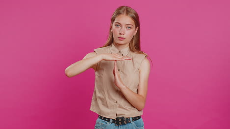 tired upset young woman showing time out gesture limit or stop sign bored of work take a break