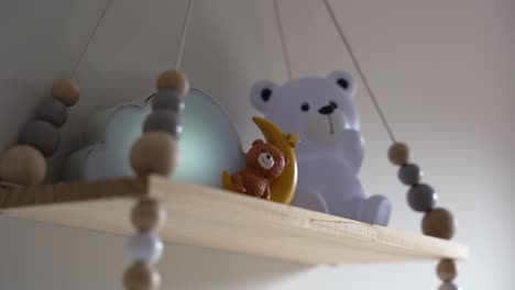 baby mobile with bear and squirrel hanging