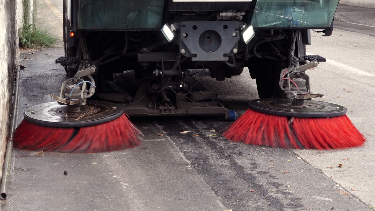 Close up of a street sweeper machine cleaning the streets