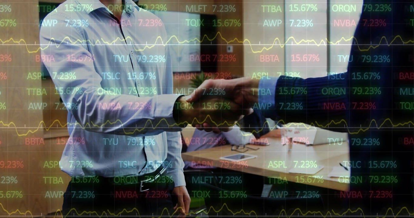 Two executives shaking hands in office boardroom, showcasing overlaid stock ticker with line graphs