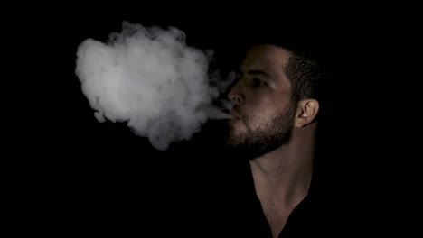 slow motion close up smoking man on black background