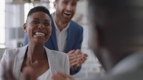 african-american-business-woman-celebrating-with-colleagues-high-five-in-office-meeting-having-fun-celebration-sharing-teamwork-victory-in-workplace