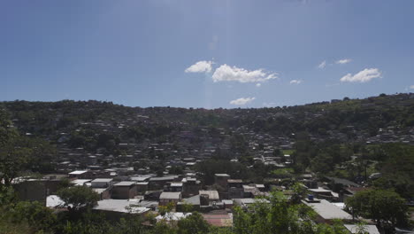 establishing shot of tegucigalpa, honduras. tilt down from the sun.