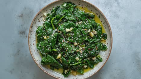 healthy spinach salad with pine nuts and cheese