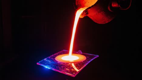 the art of molten metal: a captivating journey through the process of pouring hot liquid material into a mold, creating intricate designs with light and color