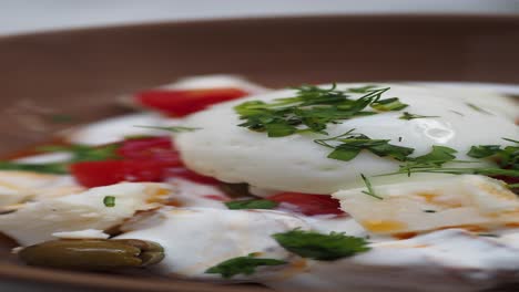 closeup of a greek salad with a poached egg