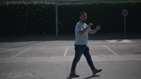 man walking and dancing on a street